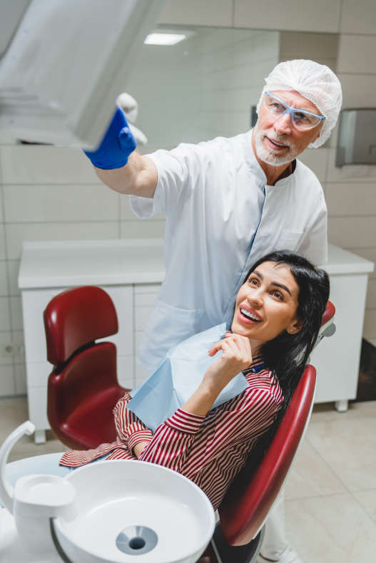 dentist smiling to patient after providing correct dosage with his ezdose medical and dental delivery system